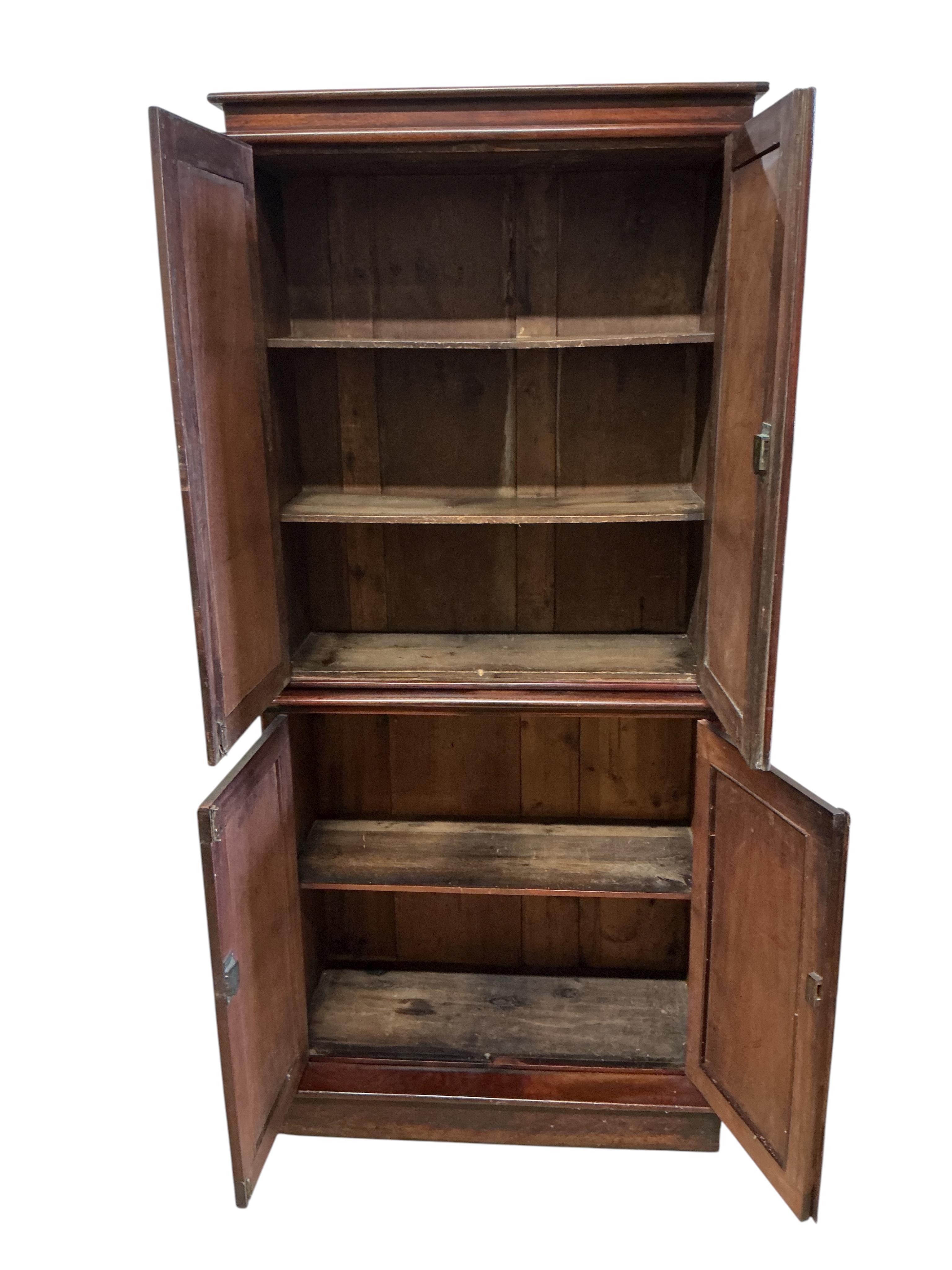 An early Victorian mahogany household cupboard, width 89cm, depth 35cm, height 187cm